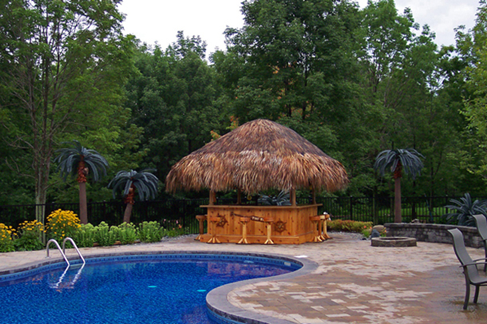Waterford, PA beautiful pool accompanied by outdoor living area with grill, bar and outdoor leisure furniture.