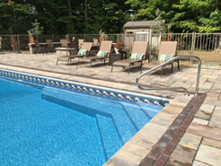 In ground pool with custom steps is shown here.