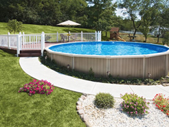Small round semi in-ground pool with attached deck.